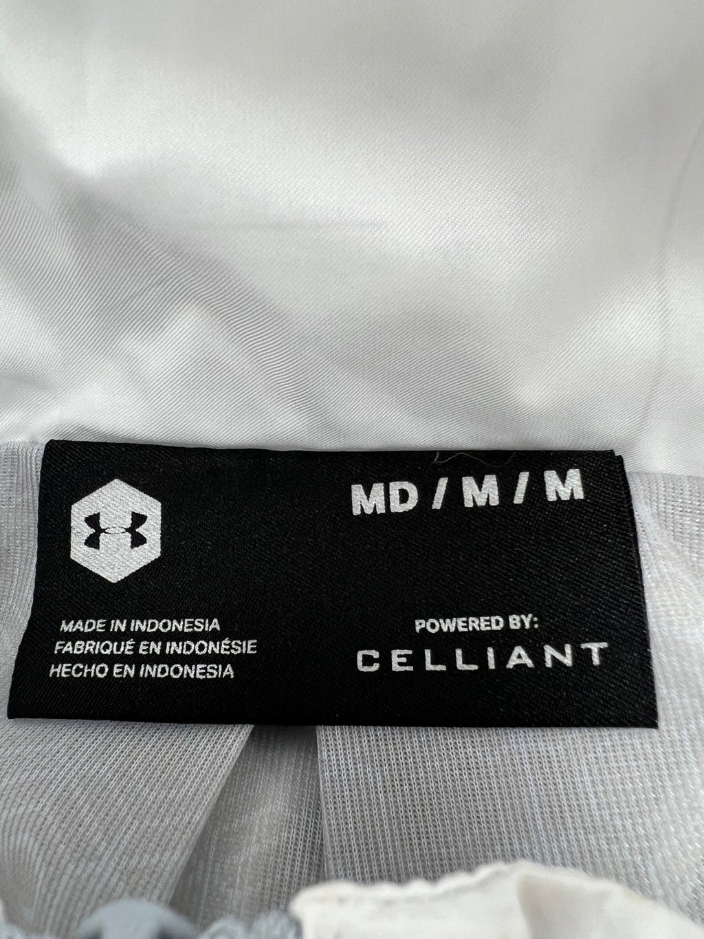 Close-up of Under Armour size and material label showing CELLIANT technology