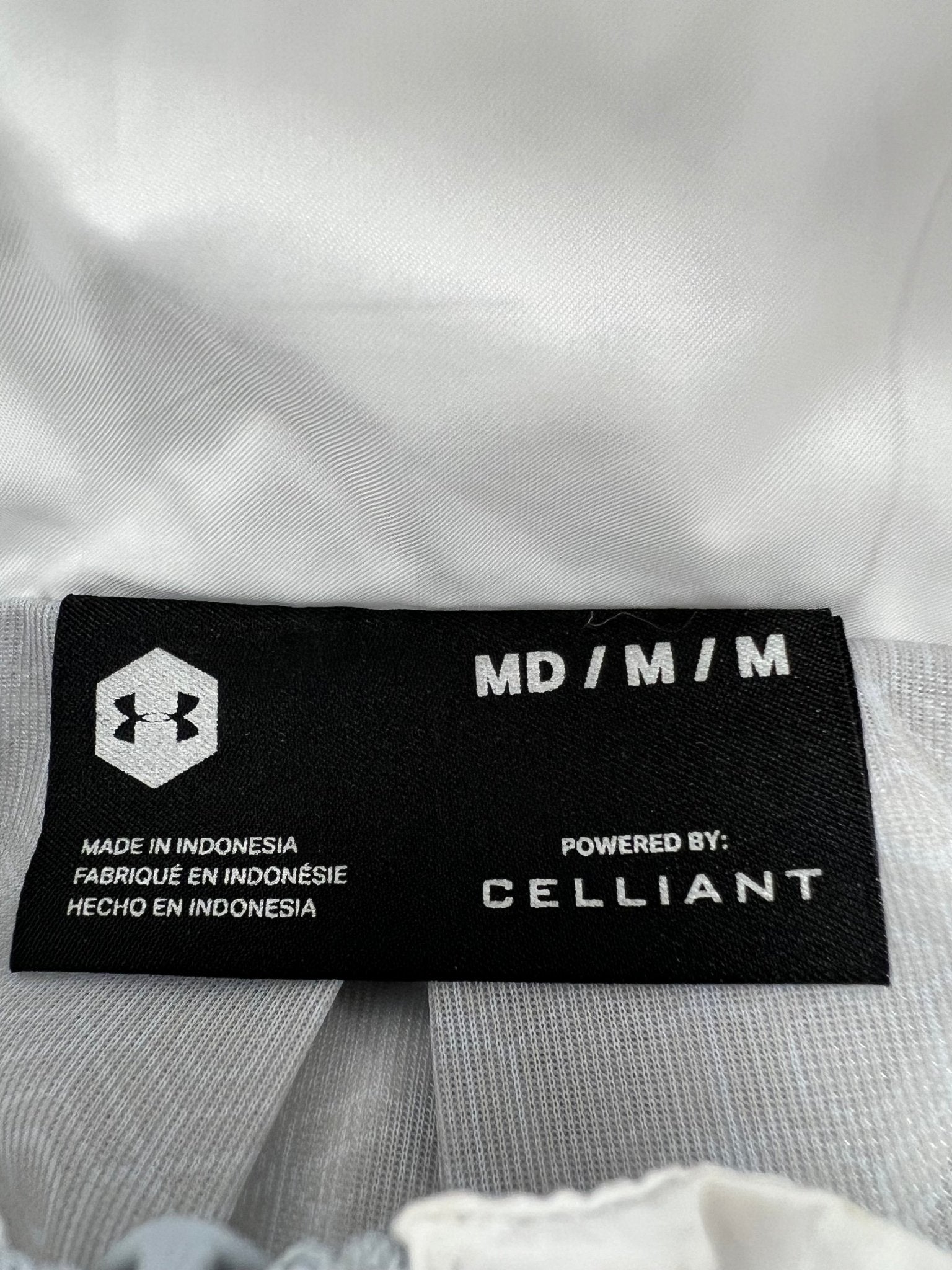Close-up of Under Armour size and material label showing CELLIANT technology