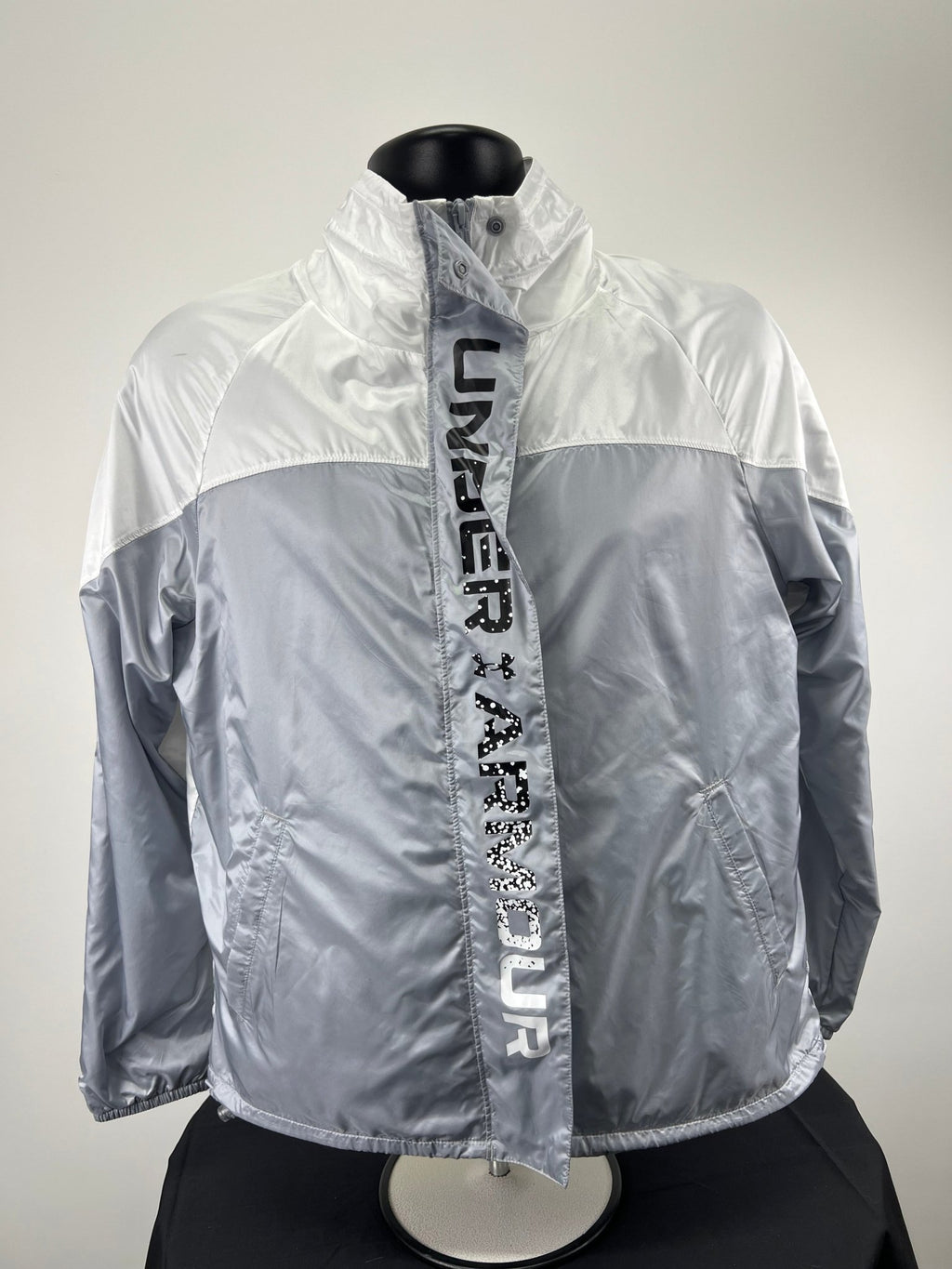 Front view of Under Armour Recover Lightweight Jacket in silver and white