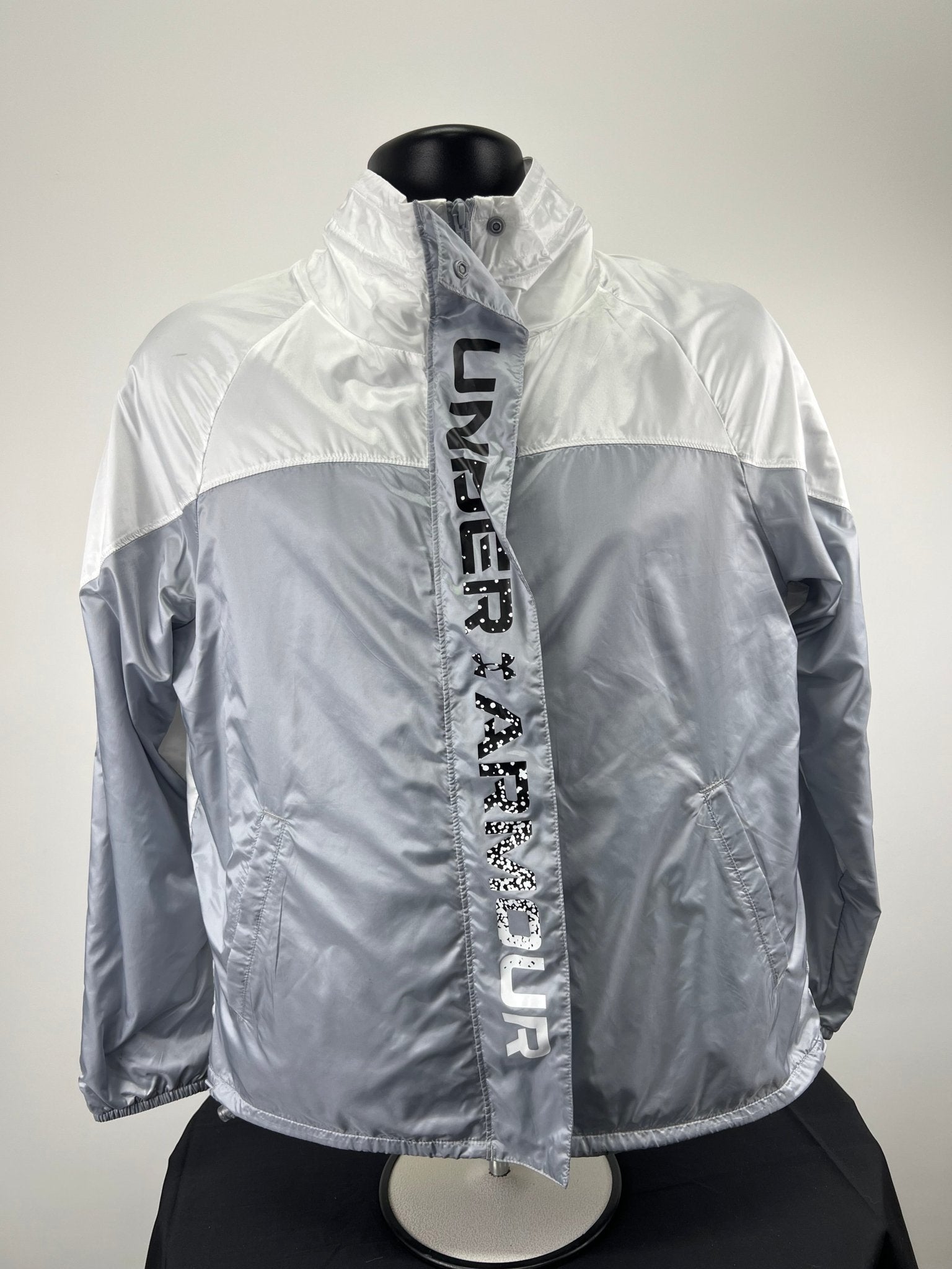Front view of Under Armour Recover Lightweight Jacket in silver and white