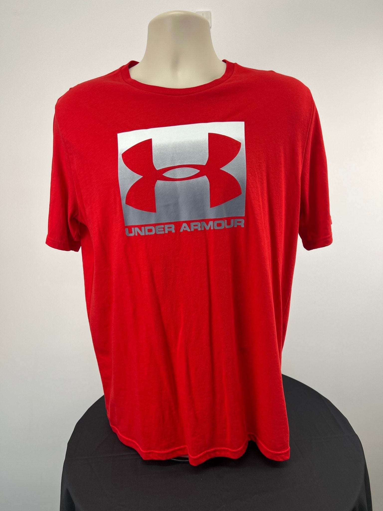 Front of red Under Armour t-shirt with large logo