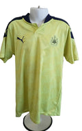 Front view of Puma Newcastle United yellow football shirt with club badge and navy details