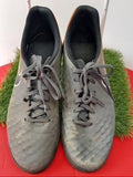 Pair of grey and orange Nike astro turf football boots viewed from top