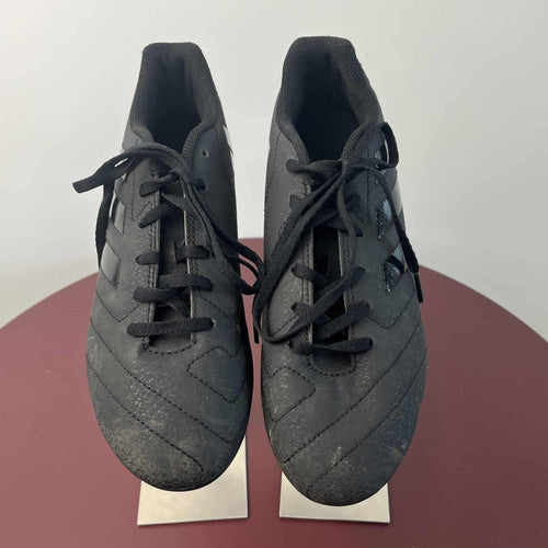 Front view of Adidas black football boots with laces tied