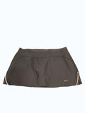 Nike black sports skirt with white trim on sides, ideal for tennis and running.