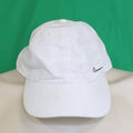 Front view of a white Nike cap with metal swoosh detail
