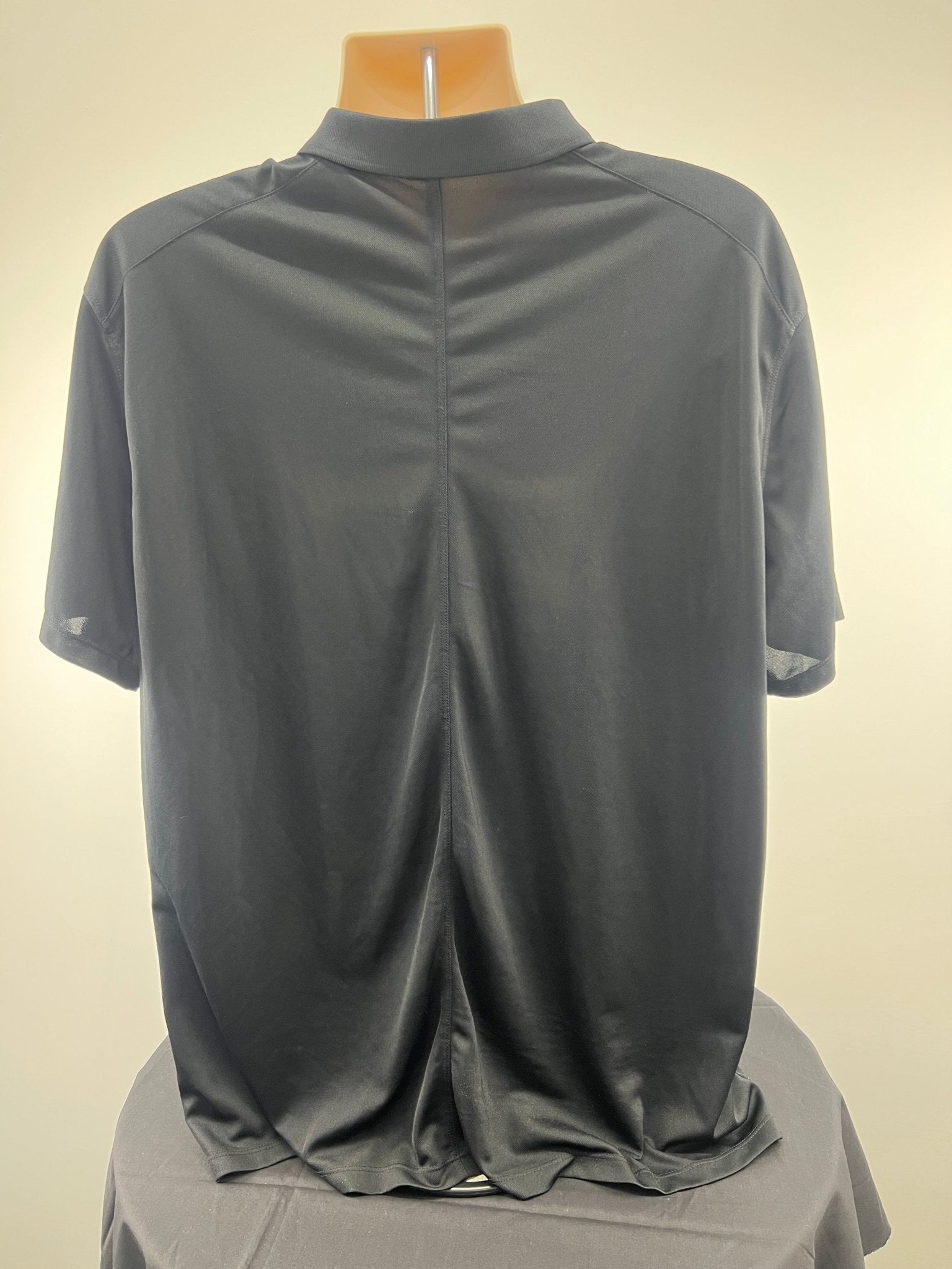 Back view of black Nike Dri-FIT short sleeve golf polo shirt in XL on mannequin