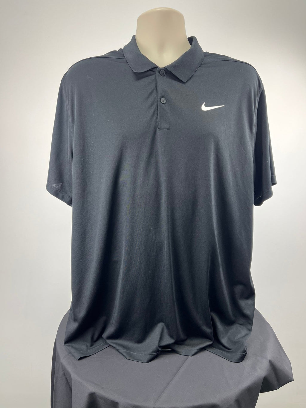 Front view of Nike black short sleeve polo shirt in XL