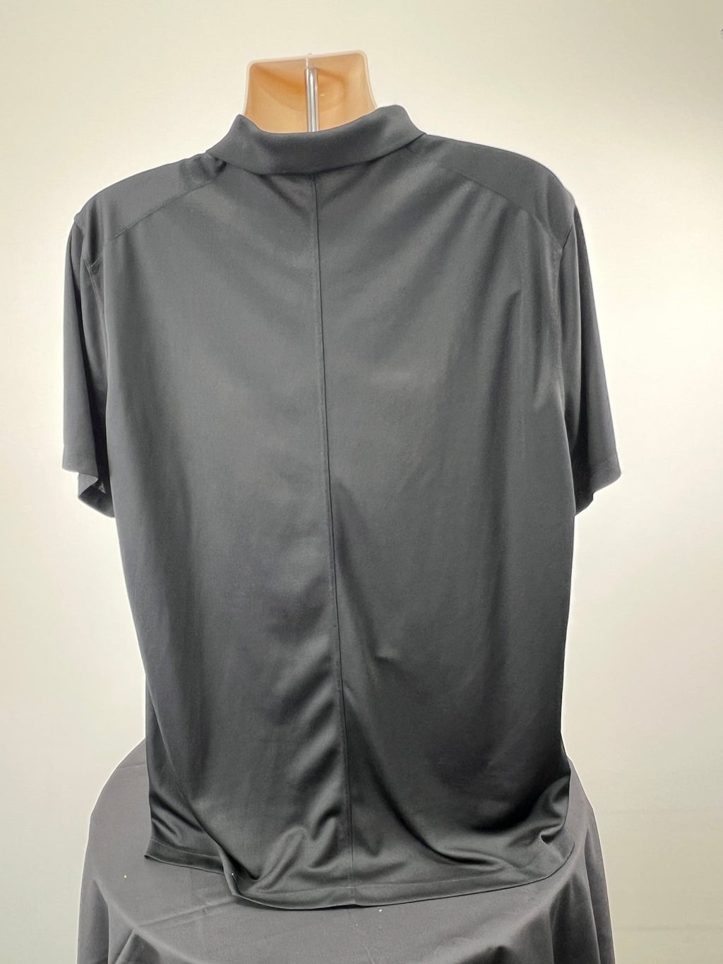 Back view of black Nike Dri-FIT short sleeve polo top in XL