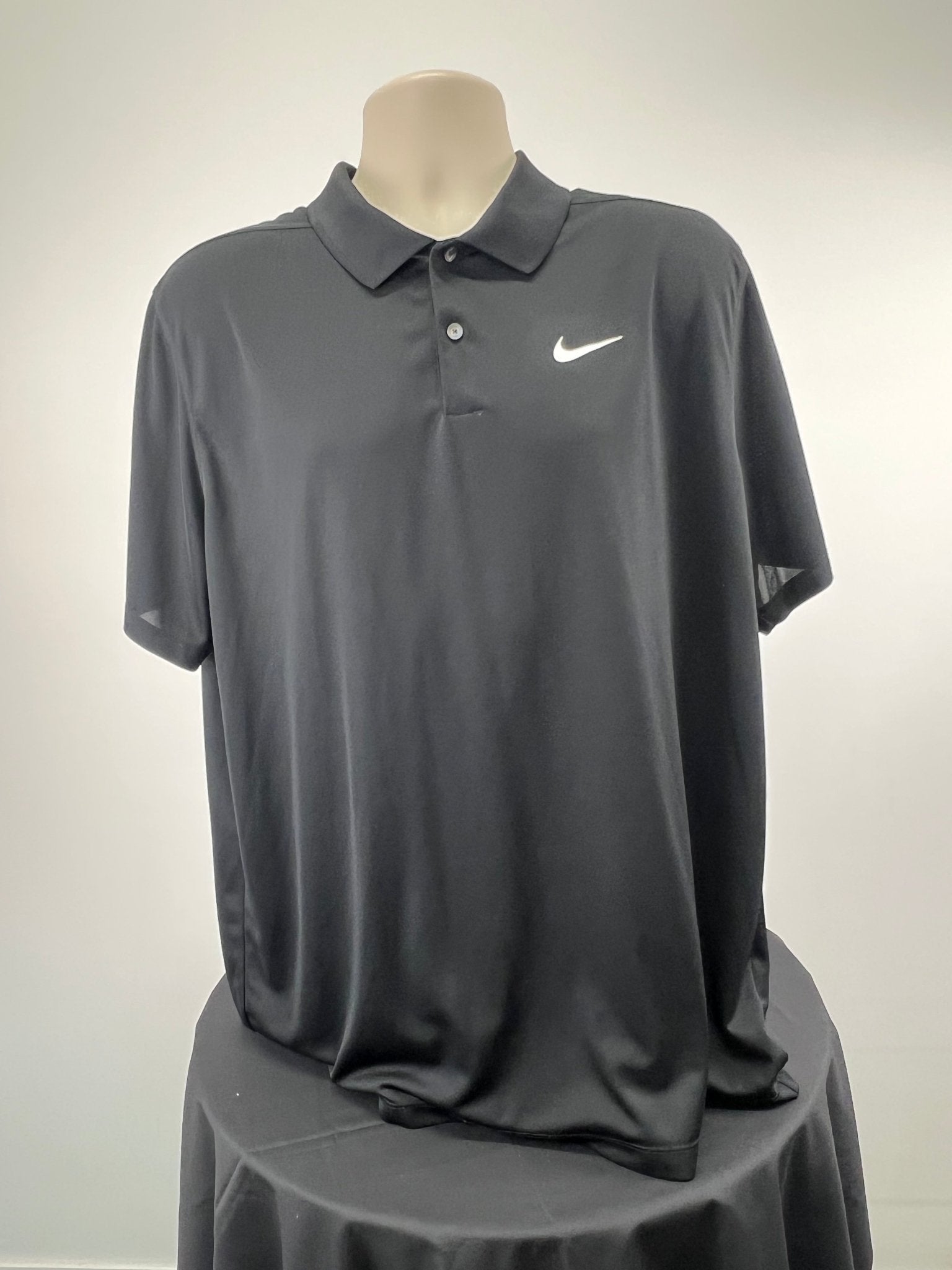 Front view of black Nike Dri-FIT short sleeve polo top in XL