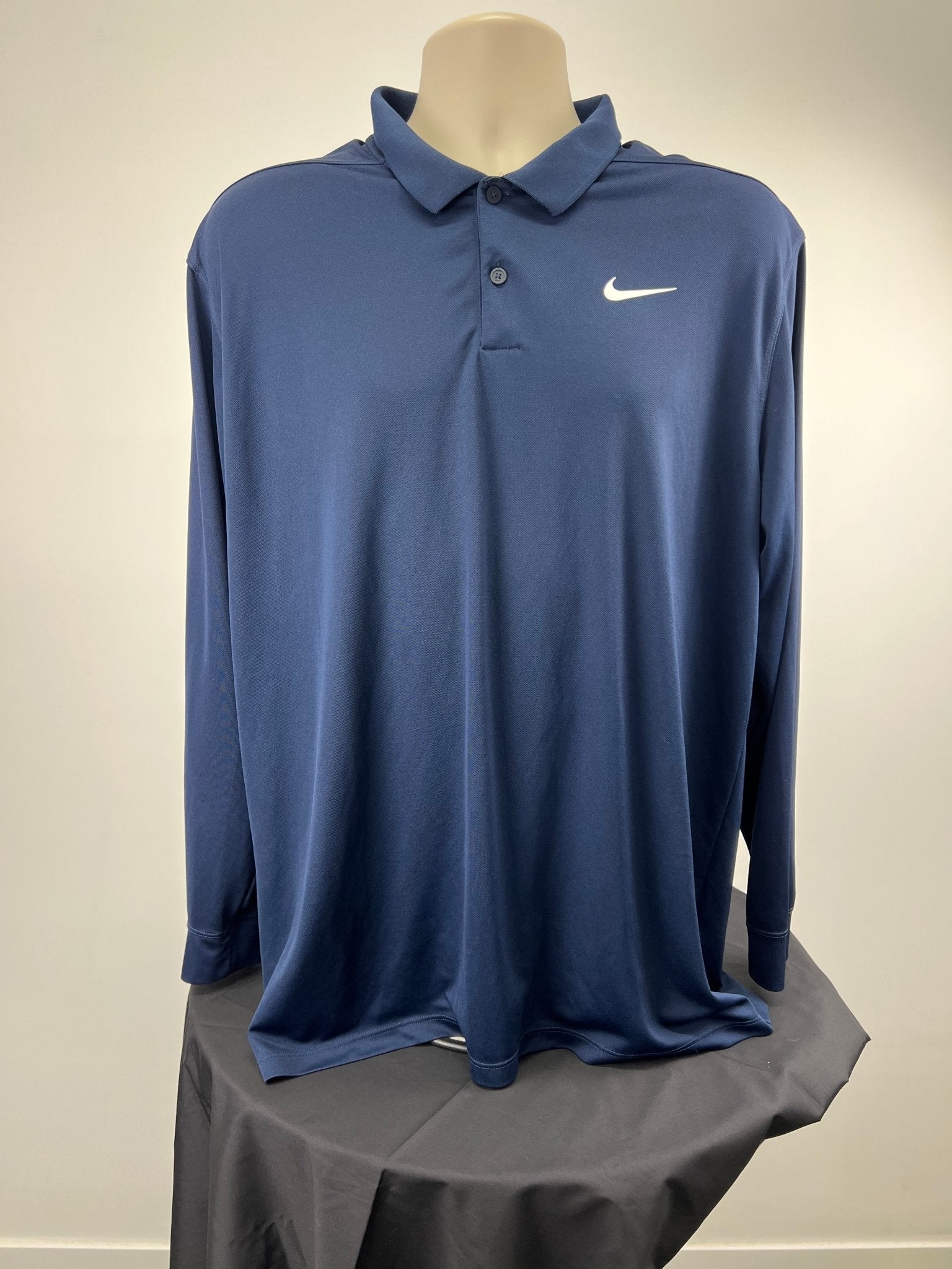 Front view of Nike dark blue long sleeve polo shirt XL with swoosh logo