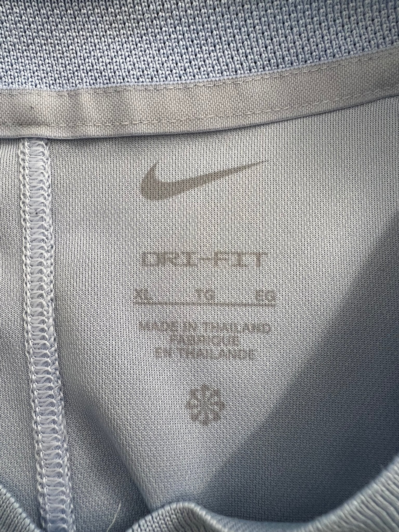 Closeup of the inside collar and Dri-FIT tag of Nike Dri-FIT men's button henley t-shirt XL
