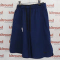 Front view of Nike Dri-Fit blue sports shorts size medium hanging on hanger