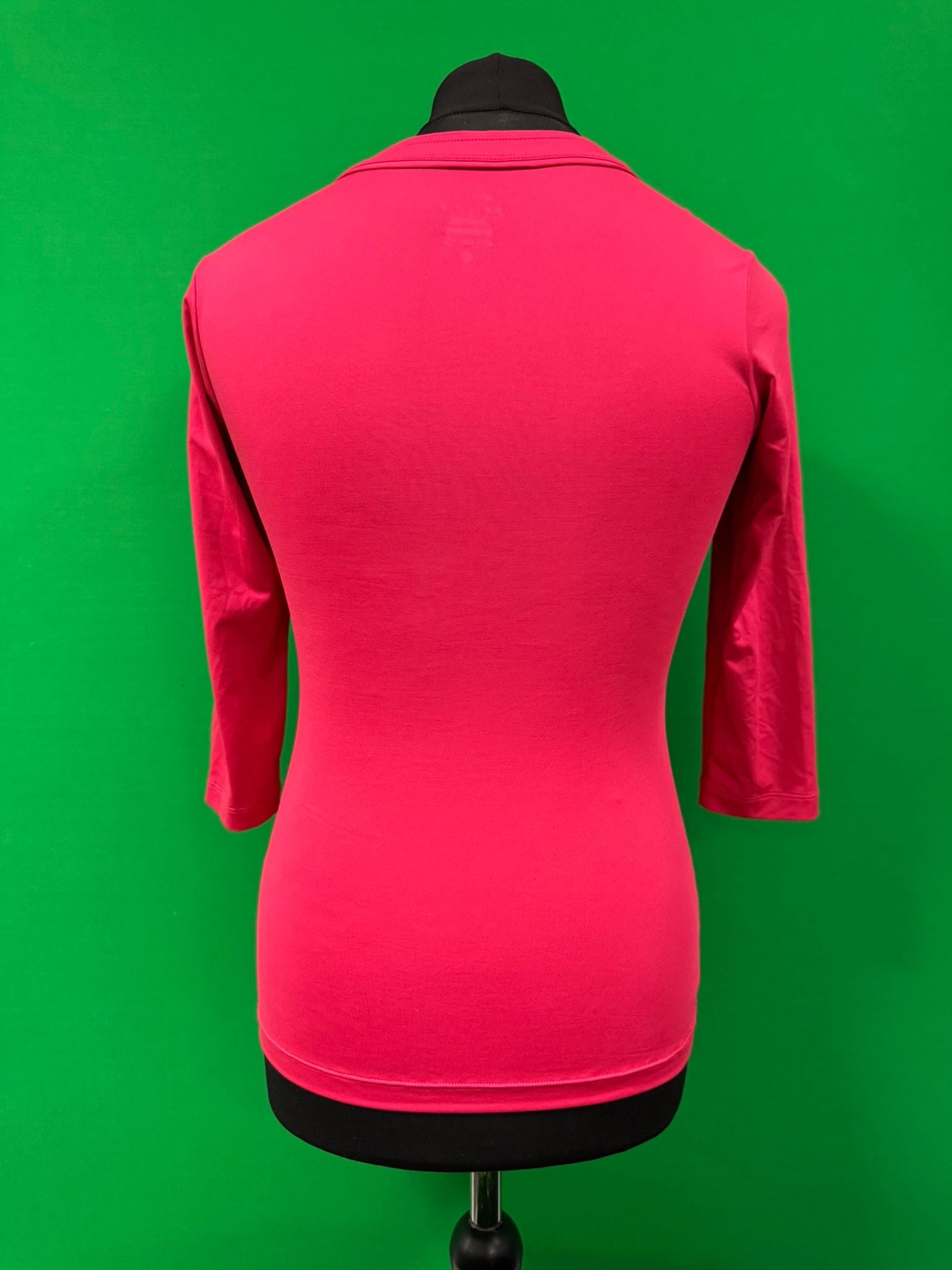 Back view of pink Nike Dri-FIT long sleeve women's top on mannequin