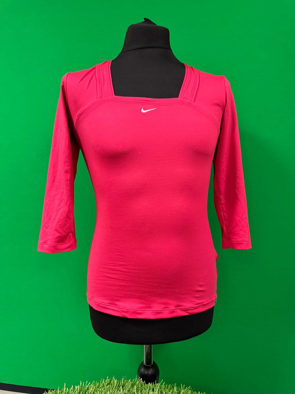 Front view of pink Nike Dri-FIT long sleeve women's top on mannequin
