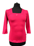 Front view of pink Nike Dri-FIT long sleeve women's top on mannequin