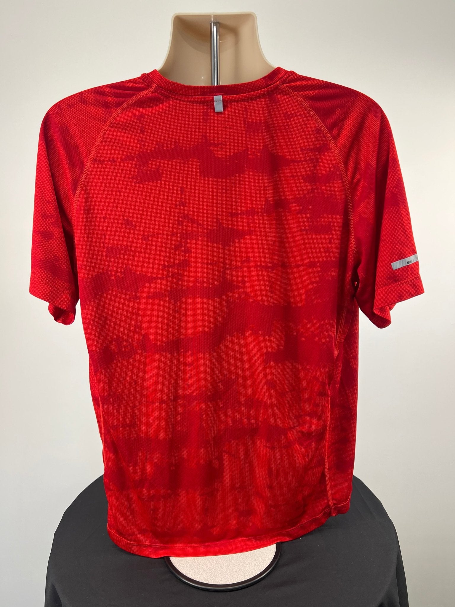 Back view of bright red Nike Dri-FIT running t-shirt in XL