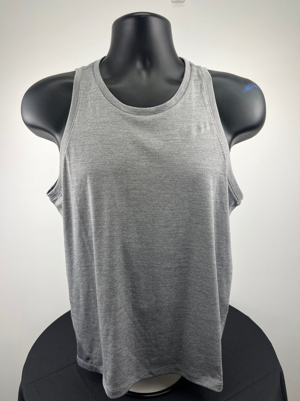 Front view of grey Nike Dri-FIT running vest on mannequin