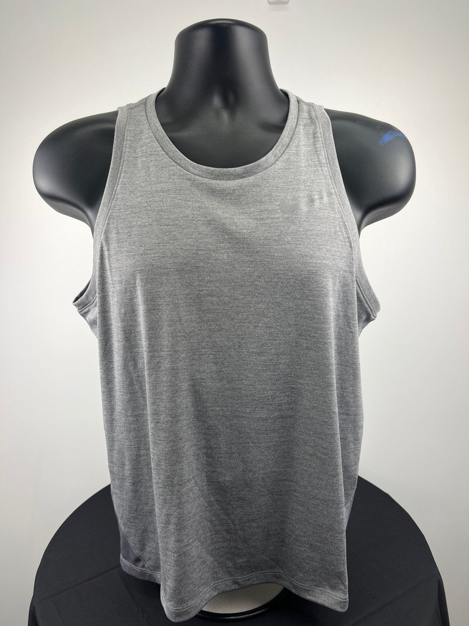 Front view of grey Nike Dri-FIT running vest on mannequin