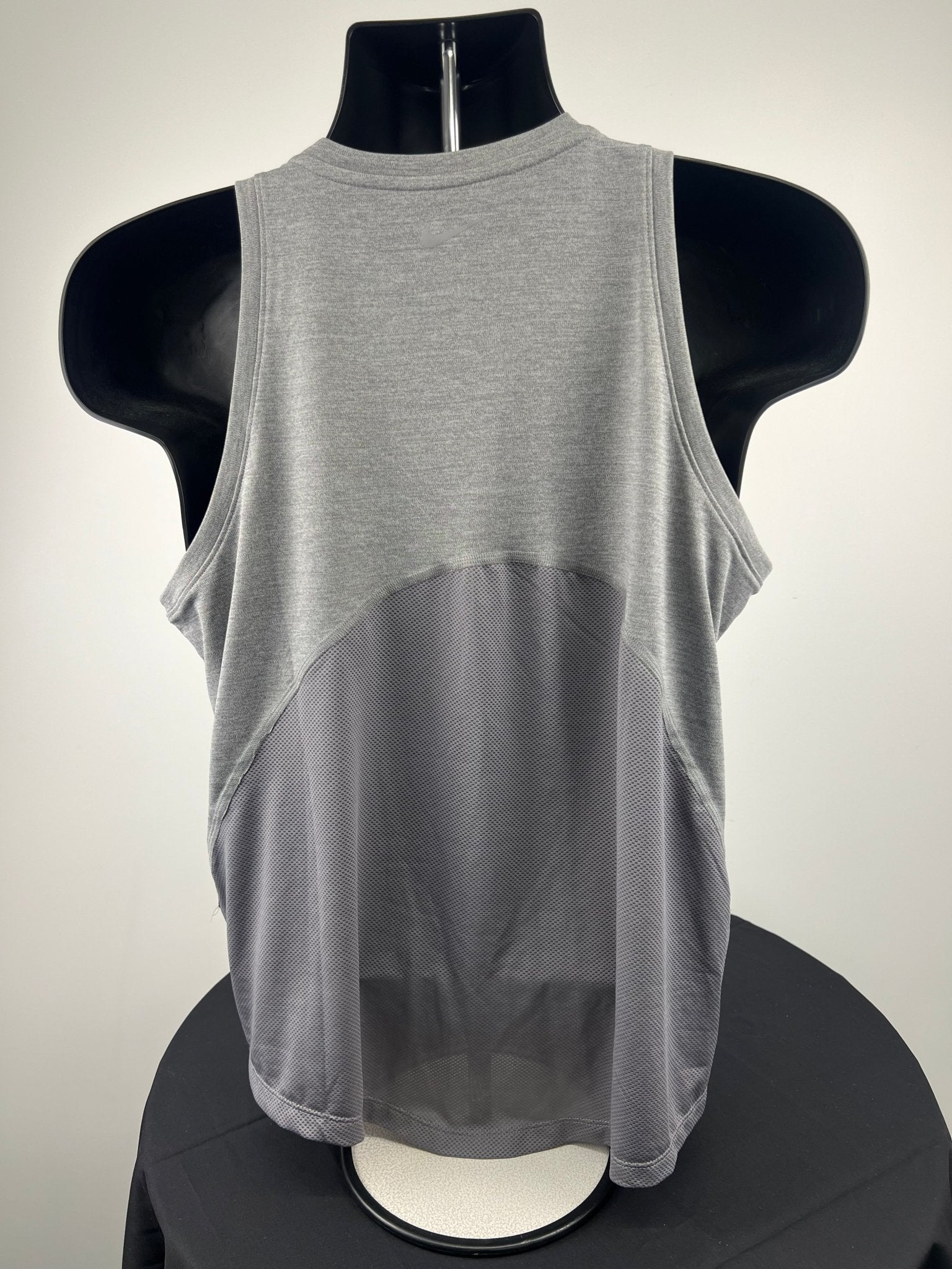Back view of grey Nike Dri-FIT running vest with mesh panel