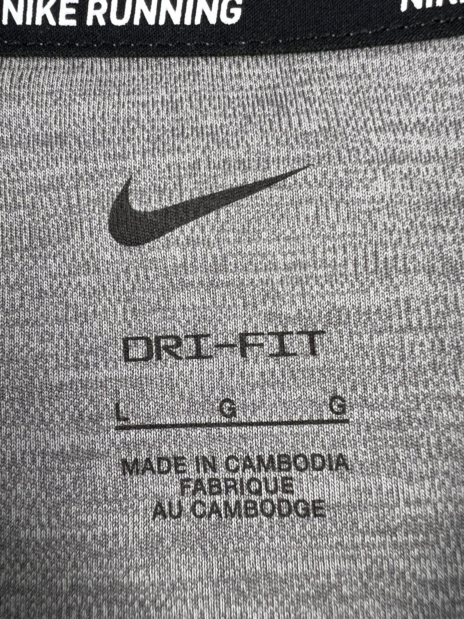 Close-up of Nike Dri-FIT label, size L