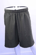 Front view of Nike Dri-FIT khaki athletic shorts with elastic waistband and black Swoosh logo