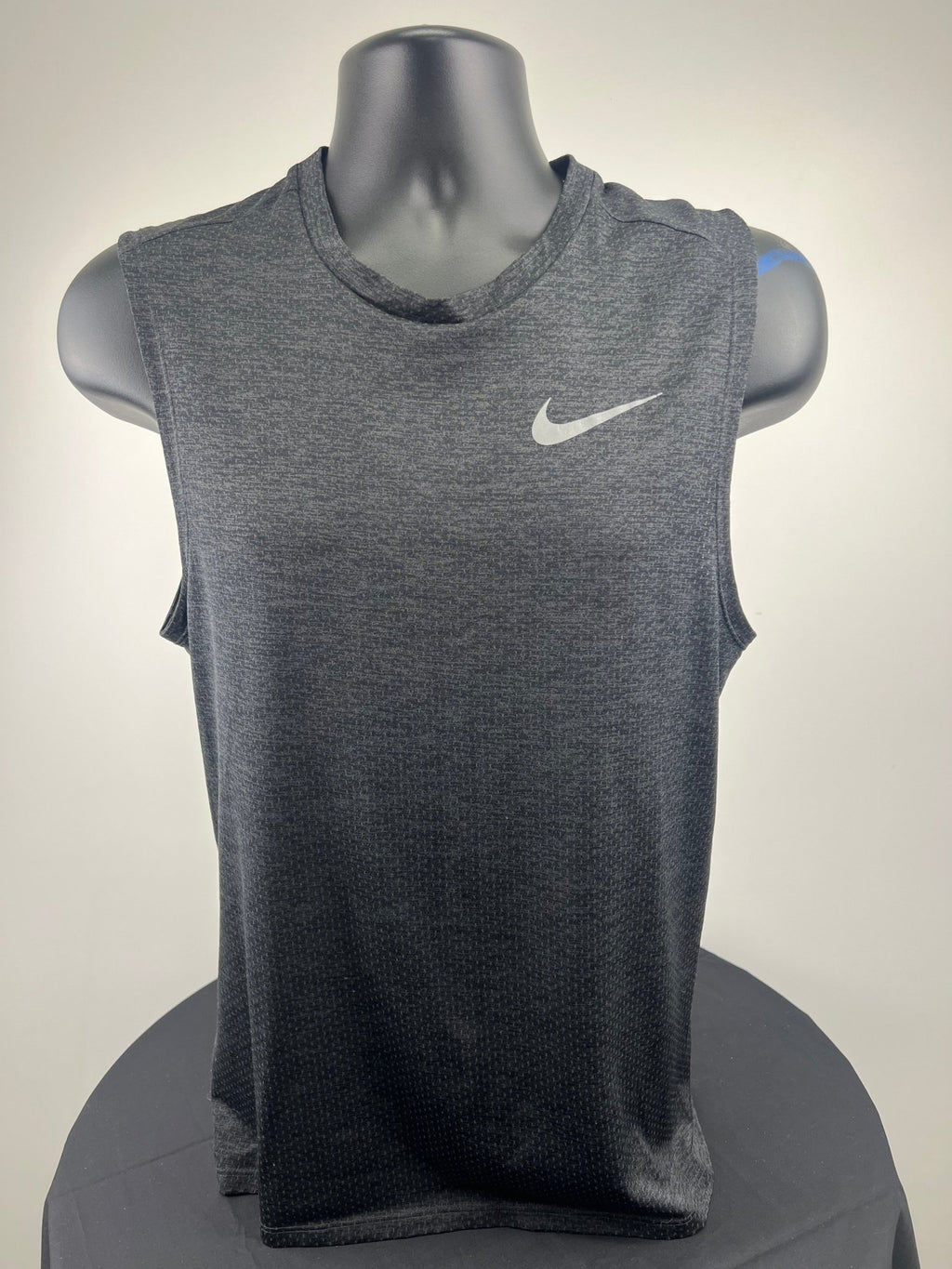 Front view of Nike Dri-FIT sleeveless running top in dark grey, size small