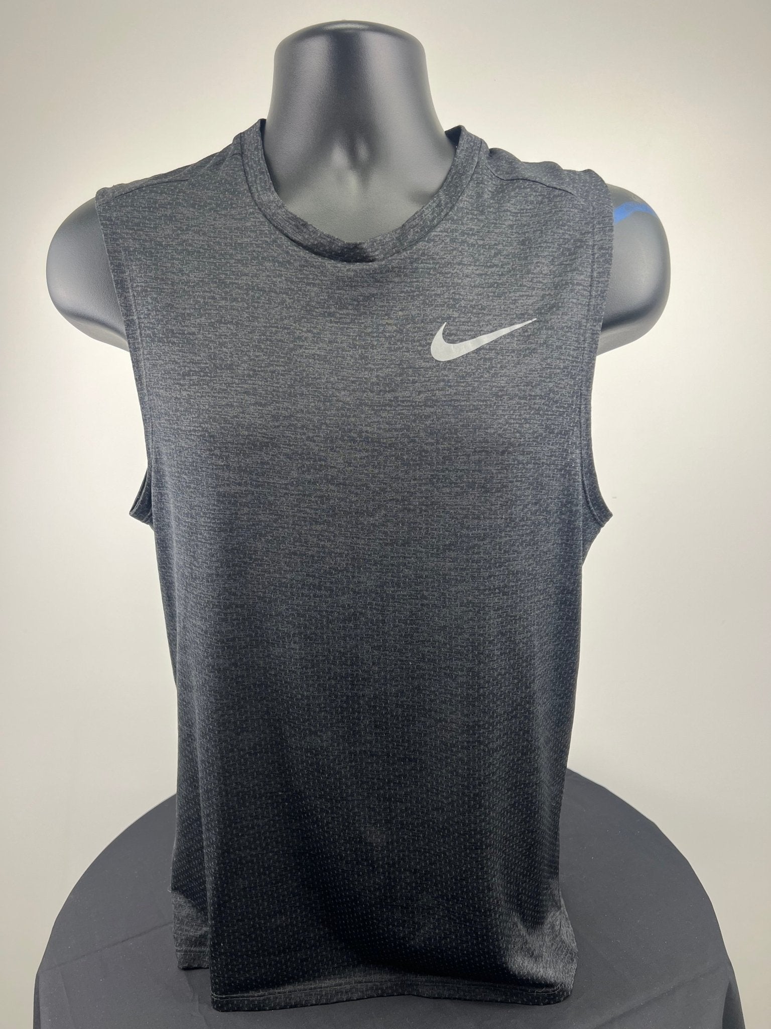 Front view of Nike Dri-FIT sleeveless running top in dark grey, size small