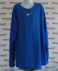 Front view of blue Nike long sleeve training top with white Swoosh