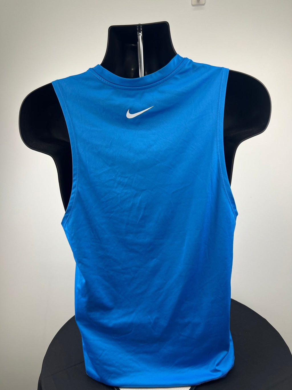 Back view of blue Nike Dri-FIT running vest with Nike swoosh logo