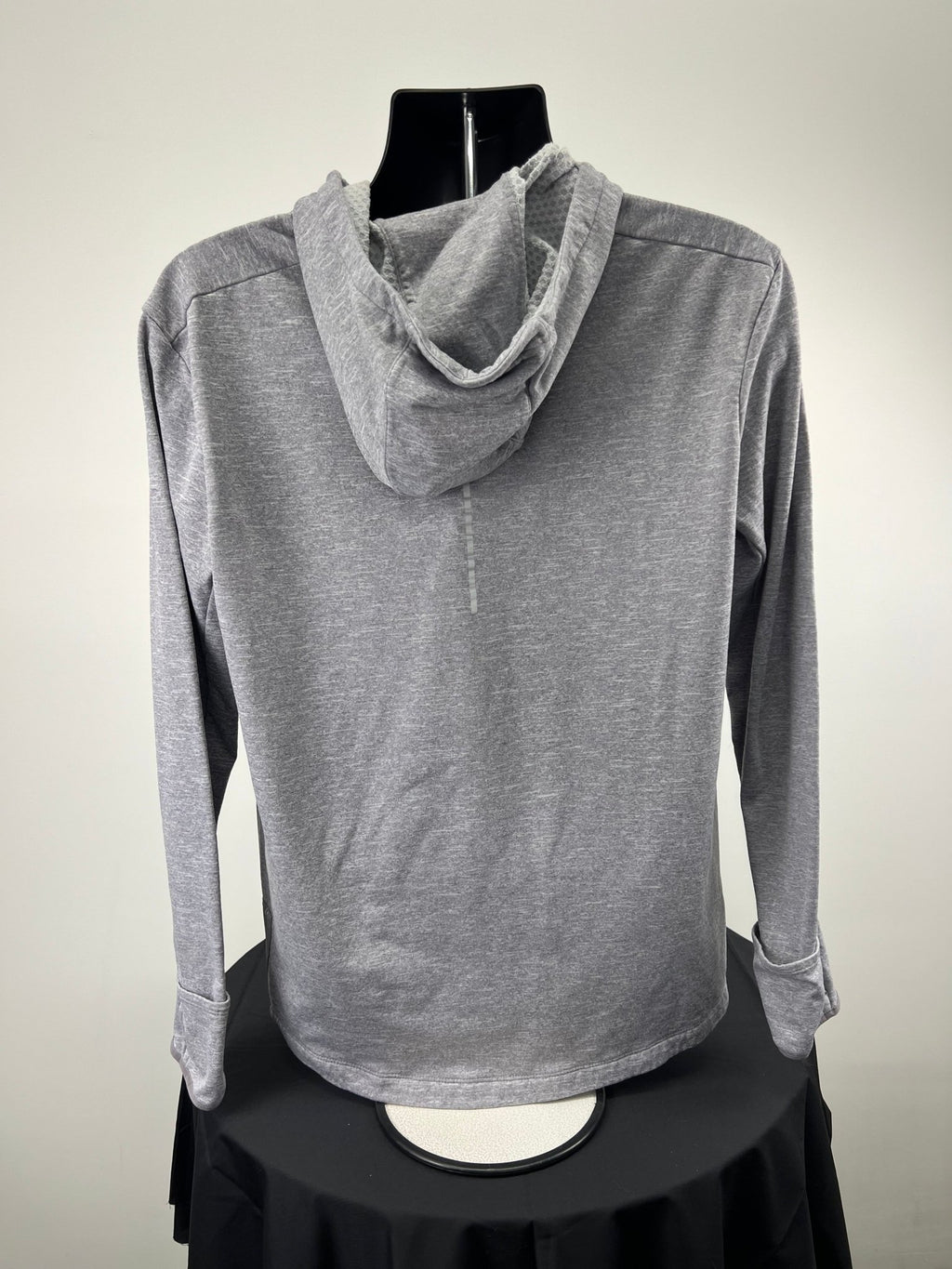 Back view of grey Nike running hoodie with hood