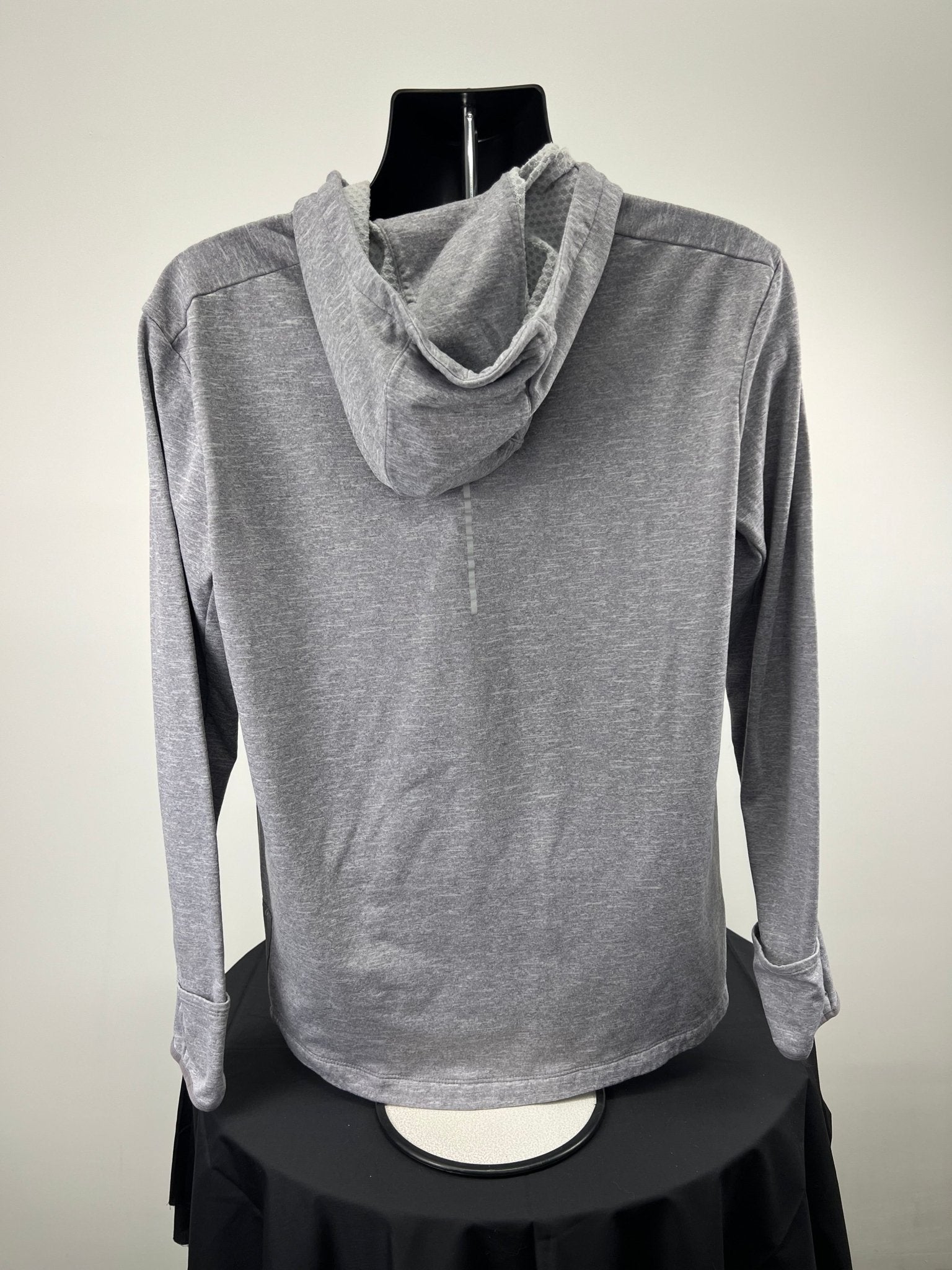 Back view of grey Nike running hoodie with hood