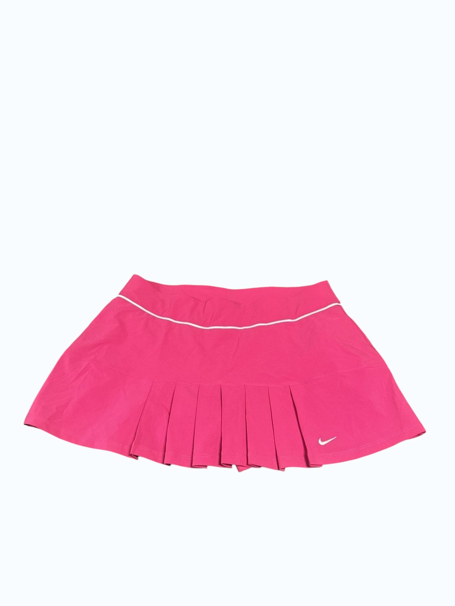 Nike pink pleated tennis skirt size M with white trim and a subtle Nike logo, ideal for performance and style.