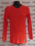 Front view of Nike Pro Combat red long sleeve compression top displayed on a mannequin
