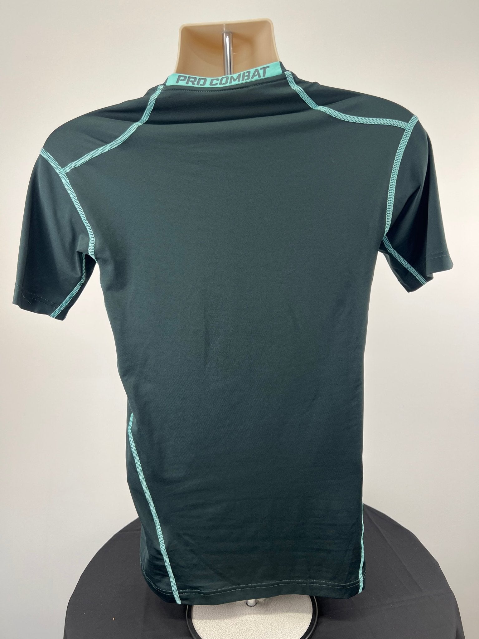 Back view of Nike Pro Combat compression top in size large, showing 'PRO COMBAT' on the collar