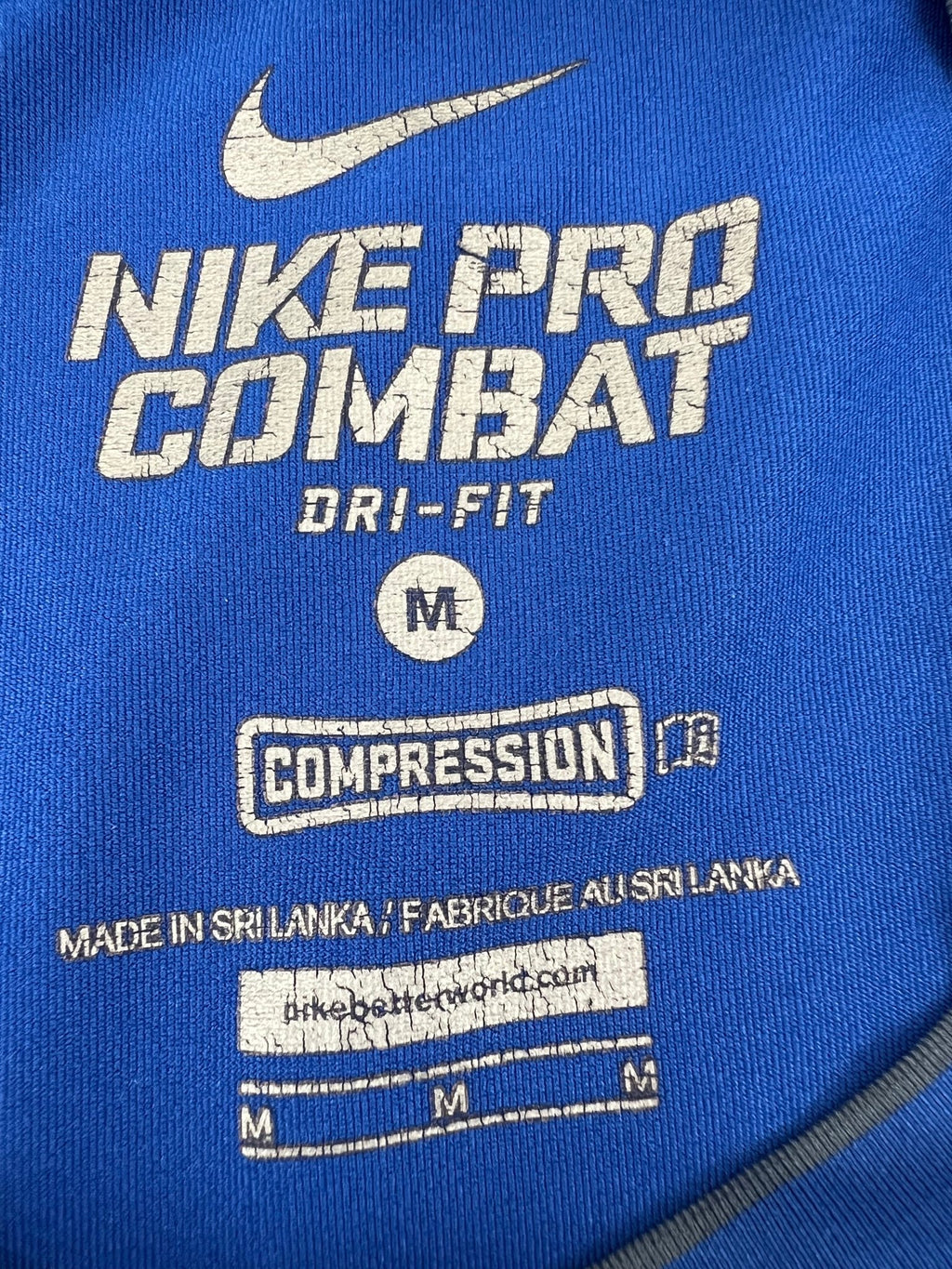 Close-up of Nike Pro Combat Dri-FIT compression t-shirt label showing size and details