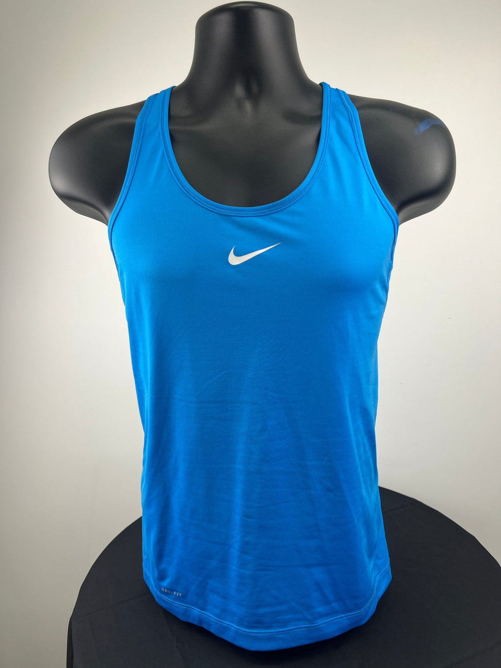 Front view of blue Nike Pro Combat Dri-FIT tank top on a mannequin