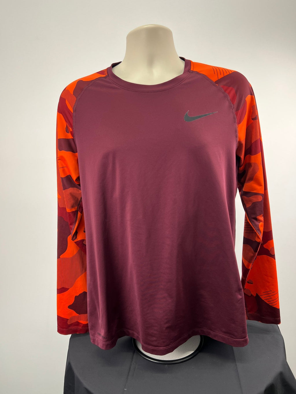 Front view of Nike Pro long sleeve burgundy top with orange camo sleeves, size large