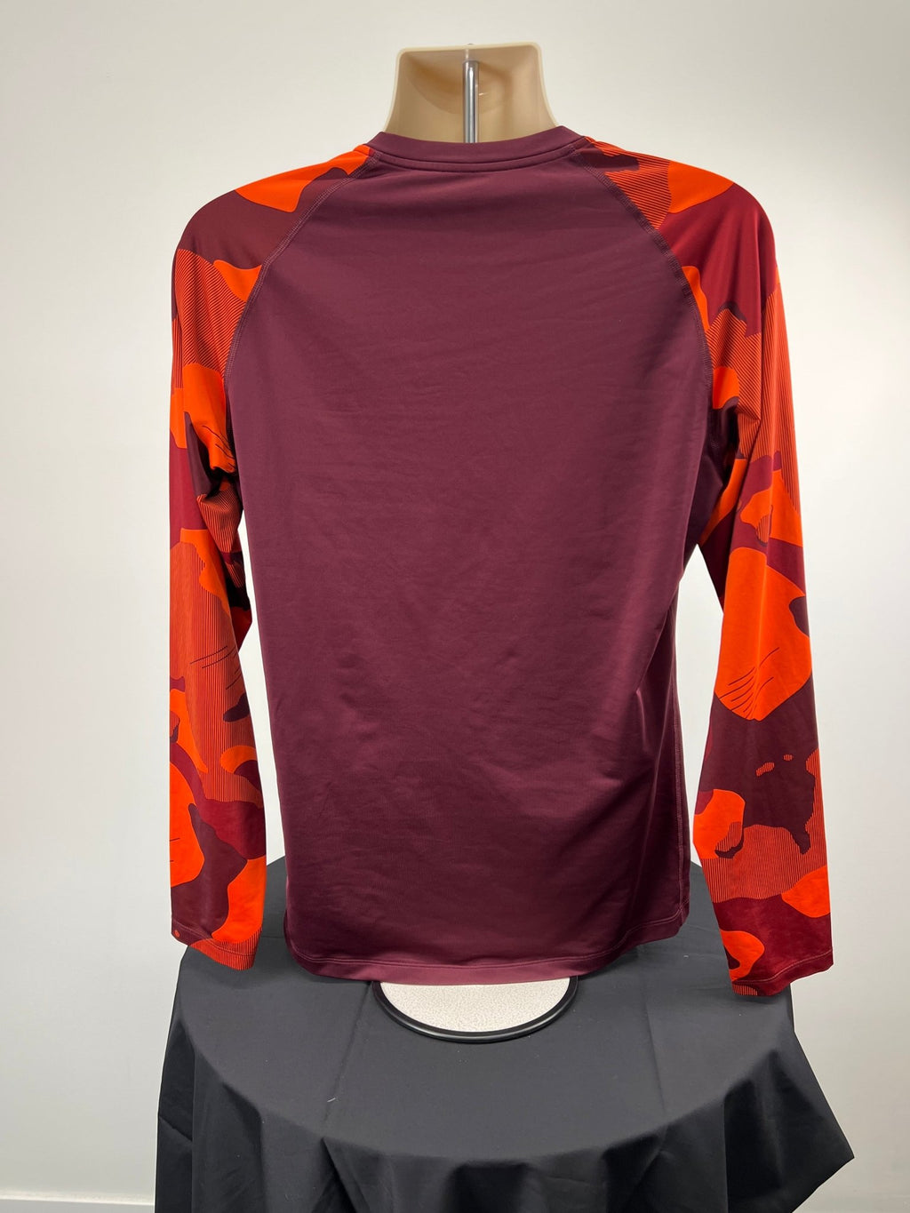 Back view of Nike Pro long sleeve burgundy top with orange camo sleeves, size large