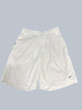 Nike white sports shorts with elastic waistband and mesh panels for breathability, ideal for tennis.