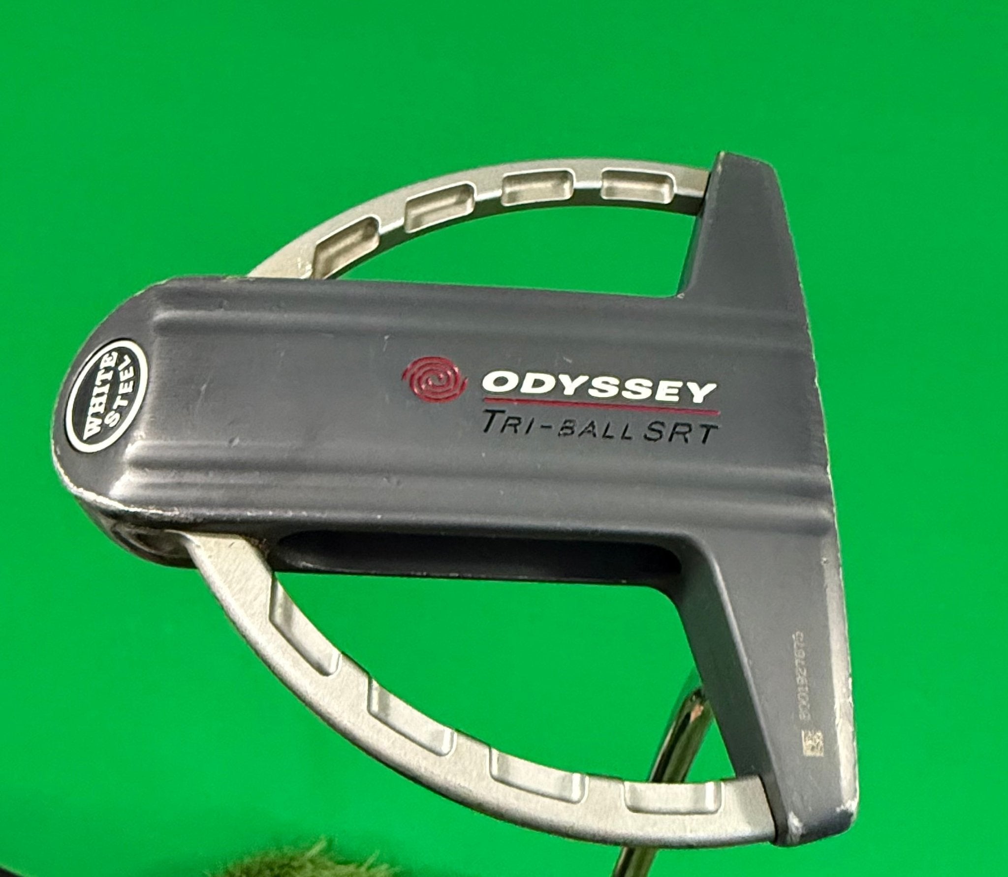 Close up of Odyssey Tri-ball SRT Putter head showing logo and design