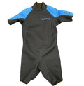 Front view of Olaian kids blue and black shorty wetsuit laid on grass