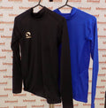 Black and blue Sondico kids long-sleeved sports tops hanging on hangers