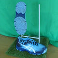 Pair of blue ASICS hockey trainers with grippy studded soles and white branding
