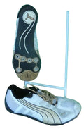 Bottom view of men's Puma running shoe showing black sole with circular grip patterns and Puma logo