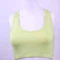 Front view of yellow Reebok racerback sports bra on mannequin