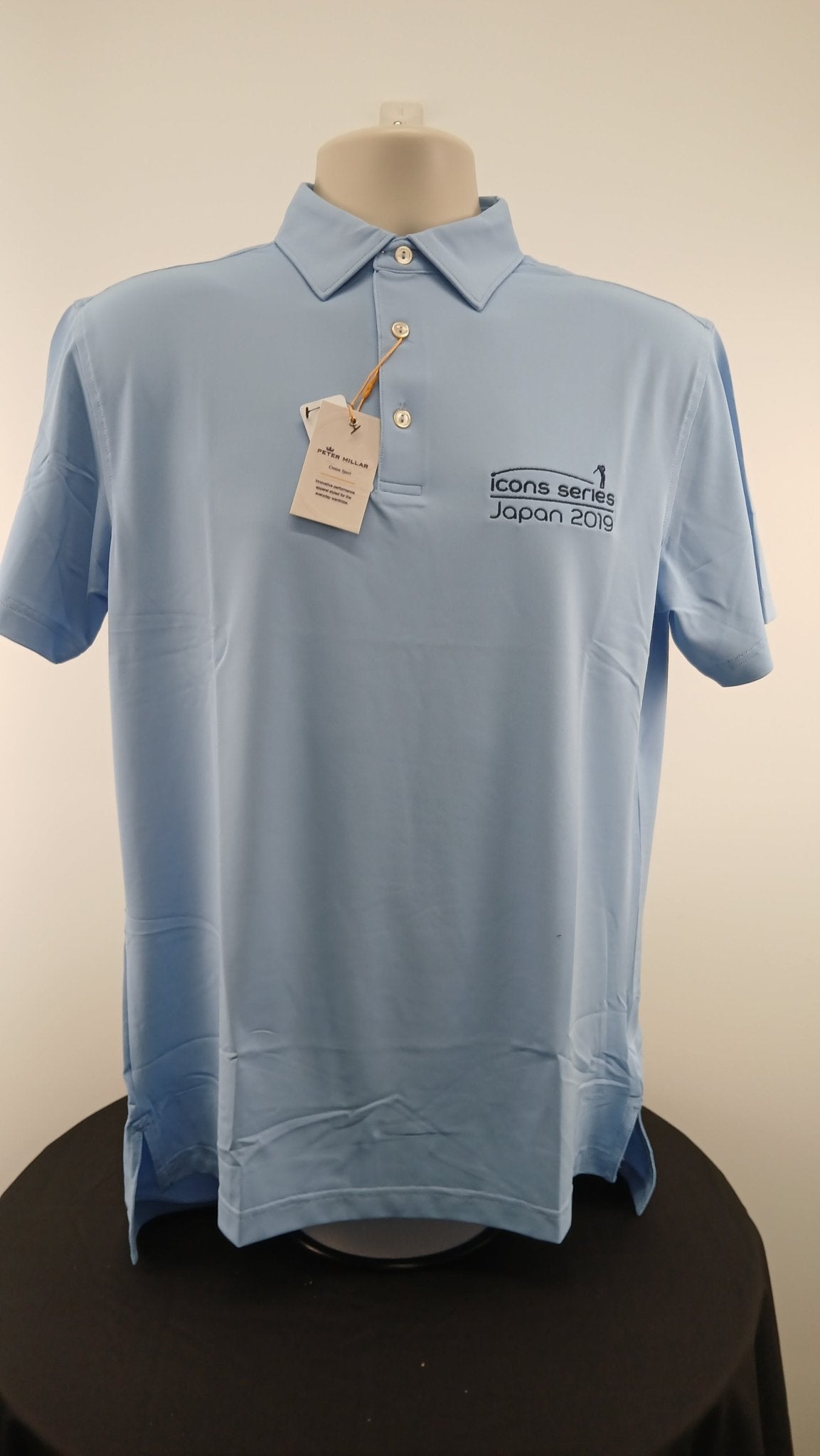 Front view of light blue Peter Millar Icons Series Japan 2019 polo shirt with tags