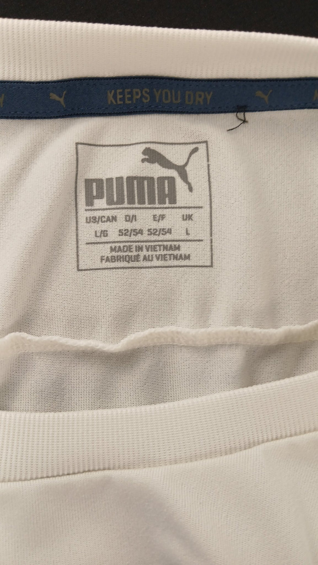 Close-up of Puma t-shirt label and neckline detail