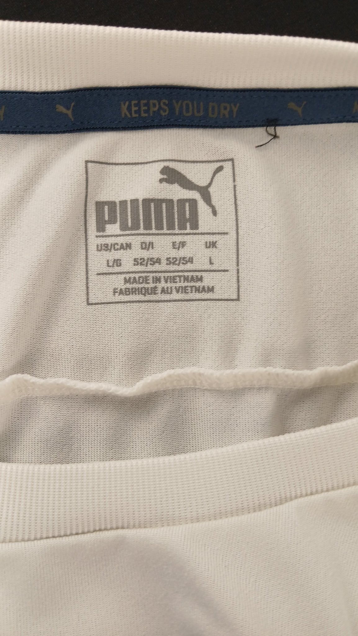 Close-up of Puma t-shirt label and neckline detail