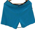 Quiksilver aqua blue board shorts displayed on hanger with kitround branding backdrop